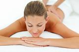 Satisfied woman enjoying a massage