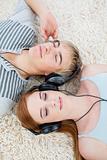 Couple of teenagers listening to music 