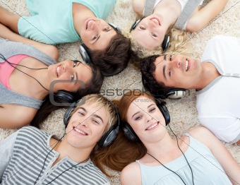 Group of friends listening to music on the floor