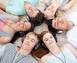 High angle of teenagers listening to music 