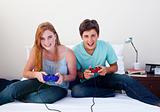 A couple of teenagers playing video games 