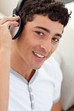Portrait of teen guy listening to music