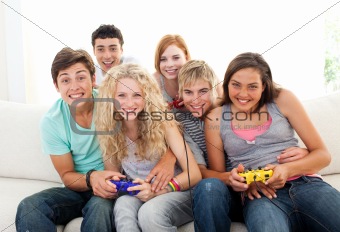 Friends playing video games in the living-room