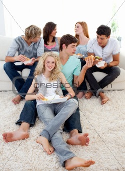 Teenagers eating burgers and fries