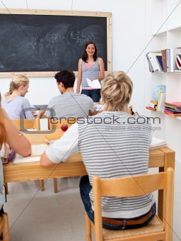 Teenagers studying together in a class