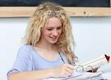 Blonde teenager doing homework