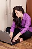 young lady working at home with laptop