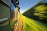 Fast riding a train with motion blur