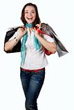 Beautiful, happy and laughing girl out shopping. Isolated on whi