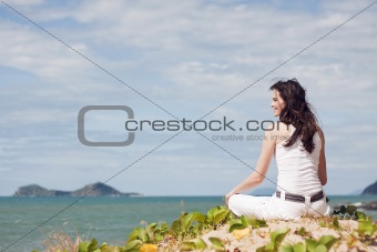 Beautiful woman relaxing on tropical beach 