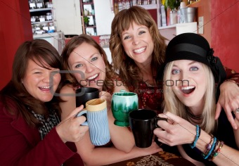 Four girlfriends enjoying time together at a bistro