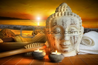 Bath accessories with buddha statue at sunset