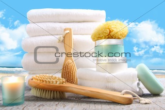 White towels with bath asessories at the beach