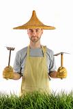 Man with Asian hat and garden tools