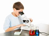 Child Looks Through Microscope