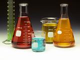 Scientific glassware filled with colored liquids