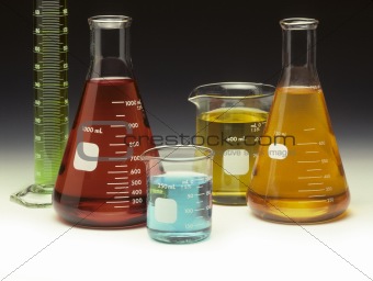 Scientific glassware filled with colored liquids