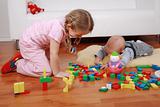 Adorable kids playing with blocks