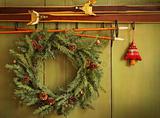 Old pair of skis hanging with wreath 