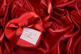 Box of chocolate with red ribbon