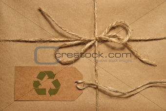 Brown shipping parcel tied with twine and tag for copy space