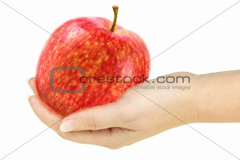 Single red apple in a hand of woman