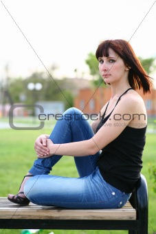 girl is posing against park