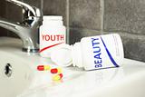 Beauty and youth pills in a bottle with shallow dof