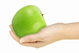 Single green apple in a hand of woman