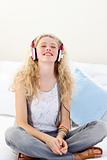Beautiful teenager listening to the music