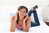 Smiling teenage girl listening to the music