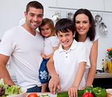 Affectionate young family cooking together