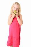 Little beautiful girl with green apple. Isolated on white backgr