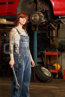 Female mechanic with tattoos