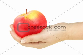 Single red apple in a hand of woman