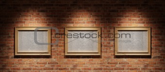 Three pictures on a brick wall