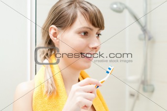 young girl with toothbrush