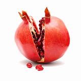 Pomegranate fruit and grains isolated on white background