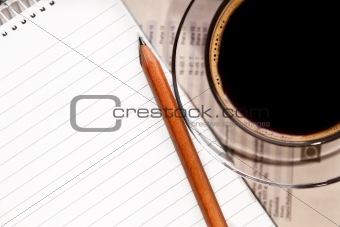 coffee and notebook on desk