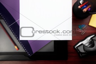 red office desk with stationery