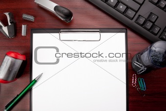 red office desk with stationery