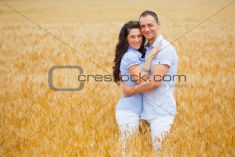 Young couple on wheat field