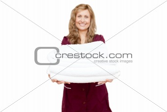 Smiling woman holding white towels