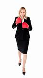 Ambitious businesswoman boxing 