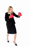 Self-assured businesswoman with boxing gloves
