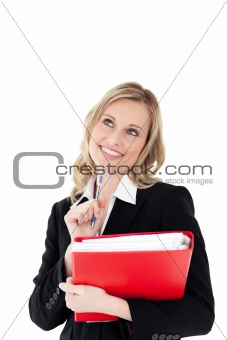 Thoughtful businesswoman with a pen