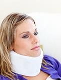 Unhappy woman with a neck brace