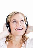 Portrait of happy girl listening to music on headphones