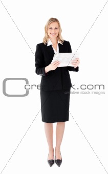 Delighted businesswoman holding a newspaper
