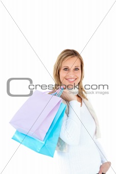 Handsome woman holding shopping bags